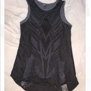 Black mesh overlay pattern layered on gray top